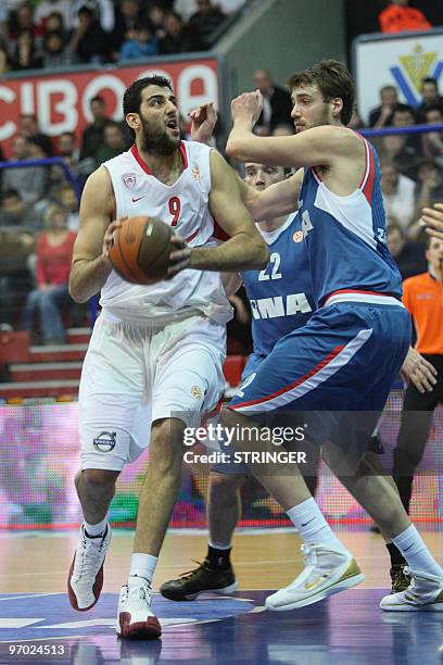 Olympiacos's Ioannis Bourousis vies with Cibona's Luksa Andric during their Euroleague basketball match Olympiacos vs Cibona in Zagreb on Feburary...