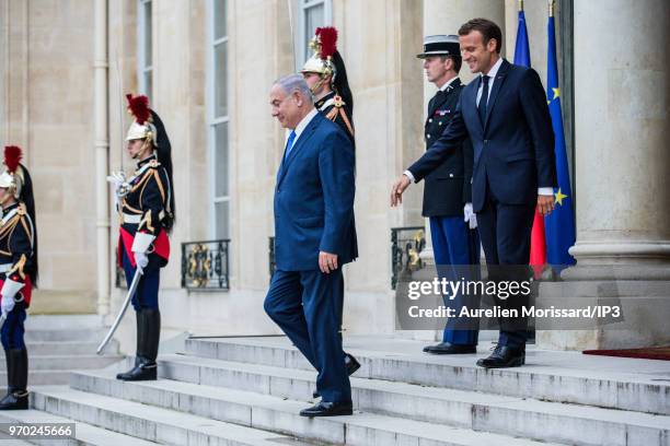 French President Emmanuel Macron escorts the Israeli Prime Minister Benjamin Netanyahu , after a meeting and a press conference at Elysee Palace on...