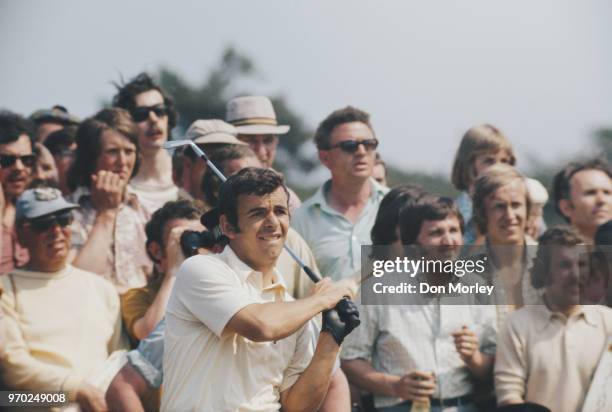 Tony Jacklin of Great Britain follows his ball onto the green during the 101st Open golf championship on12 July 1972 at The Muirfield Golf Club in...