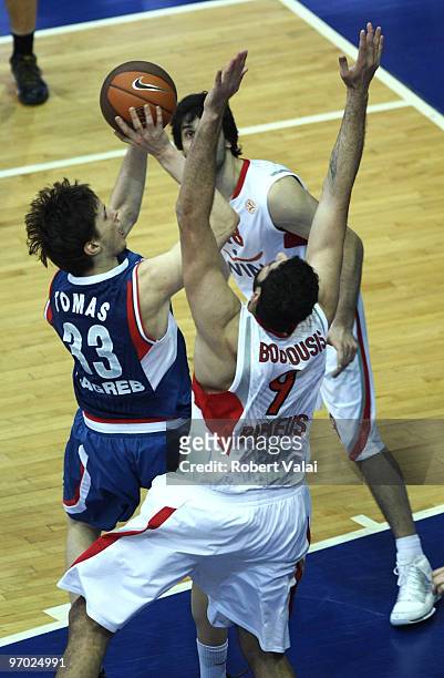 Marko Tomas of Cibona competes with Ioannis Bourousis of Olympiacos during the Euroleague Basketball 2009-2010 Last 16 Game 4 between KK Cibona...