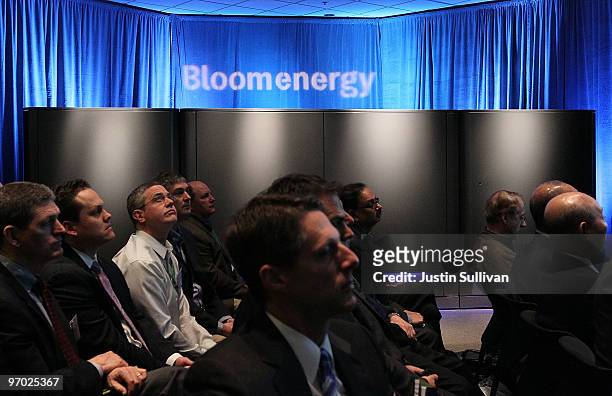 Reporters and event attendees sit next to a display of the new Bloom Energy server called the "Bloom Box" during a product launch on February 24,...