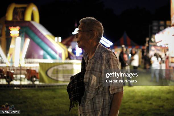 People at a small community carnaval, in Wyndmoor, PA, just outside Philadelphia, on June 8, 2018.