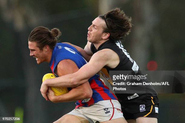 Khan Haretuku of Port Melbourne is tackled by Josh Porter of Werribee during the round 10 VFL match between Werribee and Port Melbourne at Avalon...
