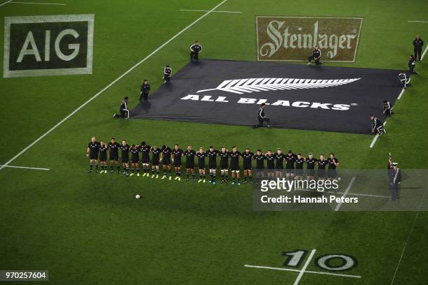 New Zealand All Blacks stand and sing the National Anthem before the International Test match between the New Zealand All Blacks and France at Eden...