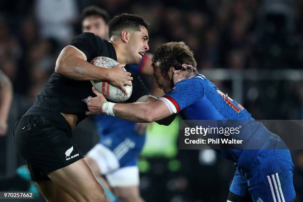 Anton Lienert-Brown of the New Zealand All Blacks is tackled by Maxime Mdard of France during the International Test match between the New Zealand...