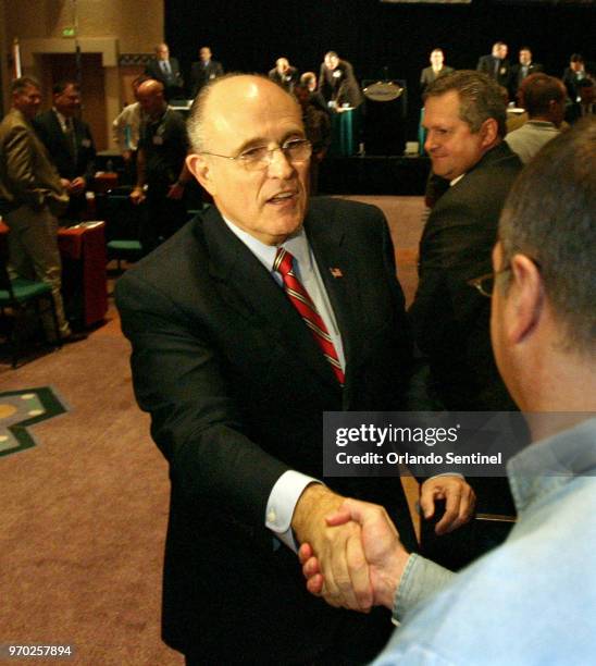 As a Republican presidential candidate, Rudy Giuliani greets voters in a 2008 file image at Disney World, near Orlando, Fla.