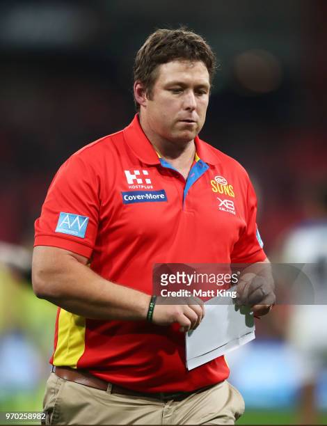 Suns coach Stuart Dew looks on during the round 12 AFL match between the Greater Western Sydney Giants and the Gold Coast Suns at Spotless Stadium on...