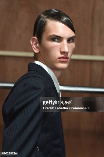 Model backstage at the Daniel W. Fletcher show during London Fashion Week Men's June 2018 at BFC Show Space on June 9, 2018 in London, England.