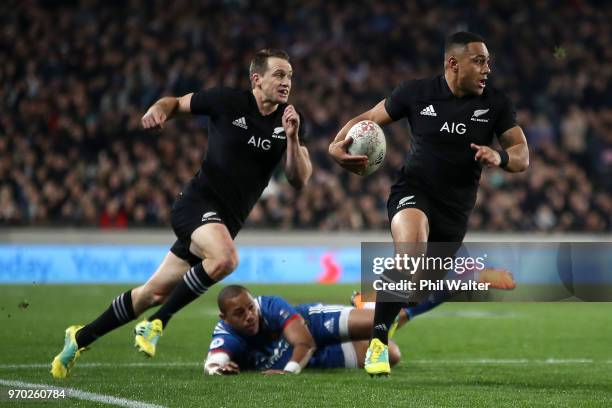 Ngani Laumape of the All Blacks makes a break to score a try during the International Test match between the New Zealand All Blacks and France at...