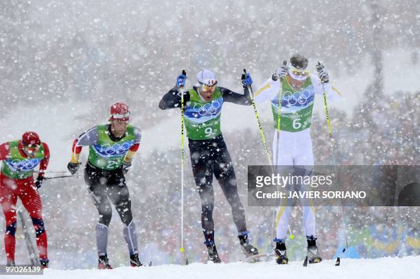 Sweden's Johan Olsson , France's Vincent Vittoz , Germany's Axel Teichmann and Norway's Odd-Bjoern Hjelmeset compete in the men's Cross Country 4x10...