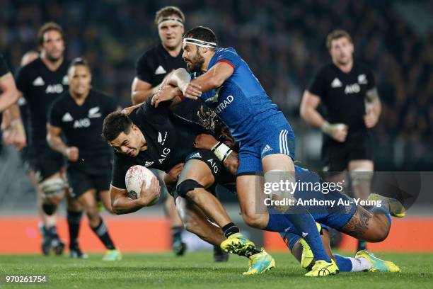 Anton Lienert-Brown of the All Blacks on the charge against Geoffrey Doumayrou of France during the International Test match between the New Zealand...