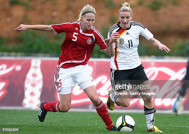 Line Hansen of Denmark and Anja Mittag of Germany battle for the ball during the Woman's Algarve Cup match between Germany and Denmark at the Estadio...