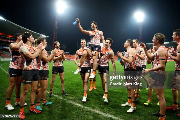 Ryan Griffen of the Giants is chaired from the field by team mates after the round 12 AFL match between the Greater Western Sydney Giants and the...