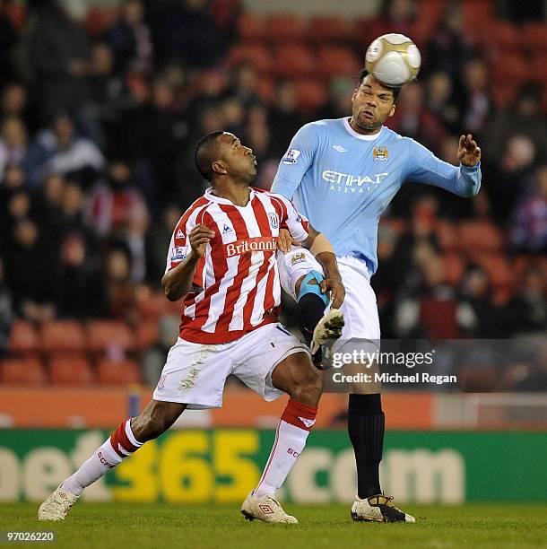 Joleon Lescott of Manchester City tackles Ricardo Fuller of Stoke during the FA Cup 5th round match between Stoke City and Manchester City at the...