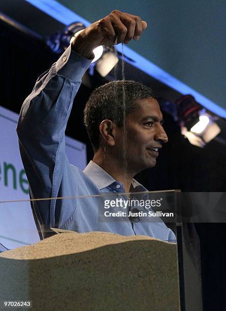 Bloom Energy CEO K. R. Sridhar drops sand that is used in the process of making fuel cells during a Bloom Energy product launch on February 24, 2010...
