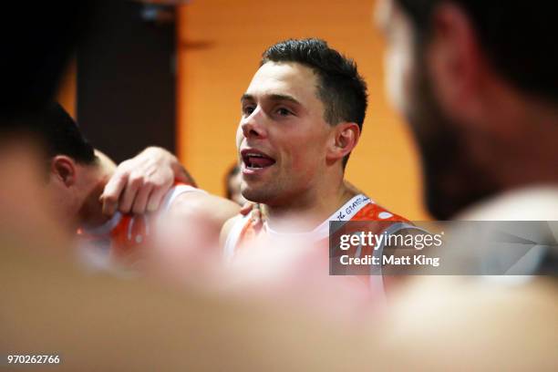 Josh Kelly of the Giants celebrates victory and sings the club song after the round 12 AFL match between the Greater Western Sydney Giants and the...