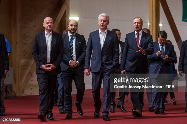 President Gianni Infantino and Mayor of Moscow Sergey Sobyanin walk on during the Official Opening of the IBC & Visit to VAR Operation Room on June...