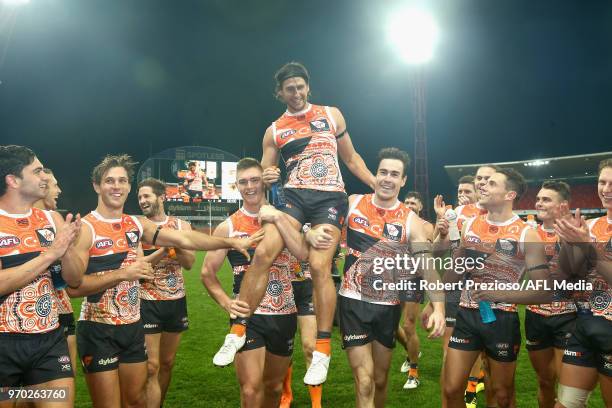 Ryan Griffen of Greater Western Sydney Giants is chaired off during the round 12 AFL match between the Greater Western Sydney Giants and the Gold...