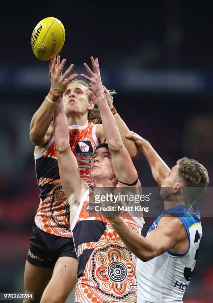 Nick Haynes and Sam Taylor of the Giants competes for the ball during the round 12 AFL match between the Greater Western Sydney Giants and the Gold...