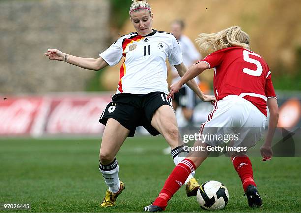 Anja Mittag of Germany and Line Hansen of Denmark battle for the ball during the Woman Algarve Cup match between Germany and Denmark at the Estadio...