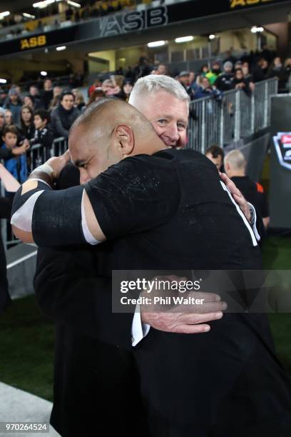 Karl Tu'inukuafe of the New Zealand All Blacks hugs NZR CEO Steve Tew during the International Test match between the New Zealand All Blacks and...