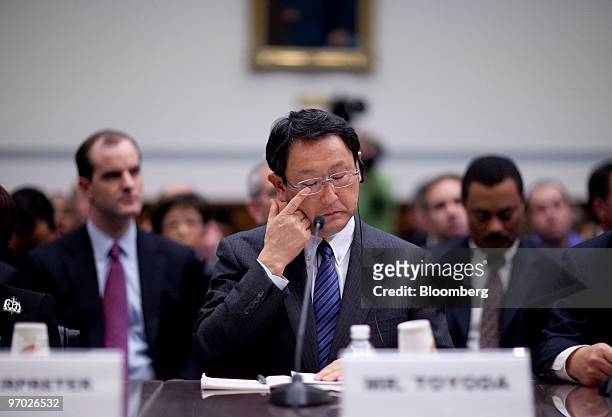 Akio Toyoda, president of Toyota Motor Corp., rubs his eye during a House Oversight and Government Reform Committee hearing in Washington, D.C.,...