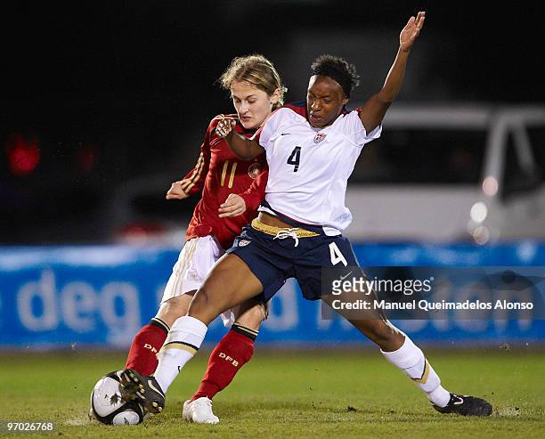 Anne Bartke of Germany and Cristal Dunn of USA battle for the ball during the Women's international friendly match between Germany and USA on...