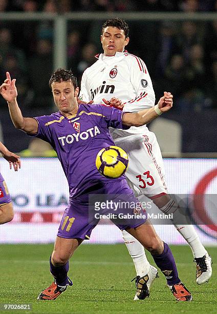 Alberto Gilardino of ACF Fiorentina battles for the ball with Emanuel Thiago Silva of AC Milan during the Serie A match between ACF Fiorentina and AC...