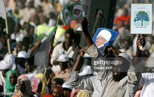 Sudanese listen to President Omar al-Beshir's speech at a rally in El-Fasher, the capital of North Darfur state, on February 24, 2010. "The war in...
