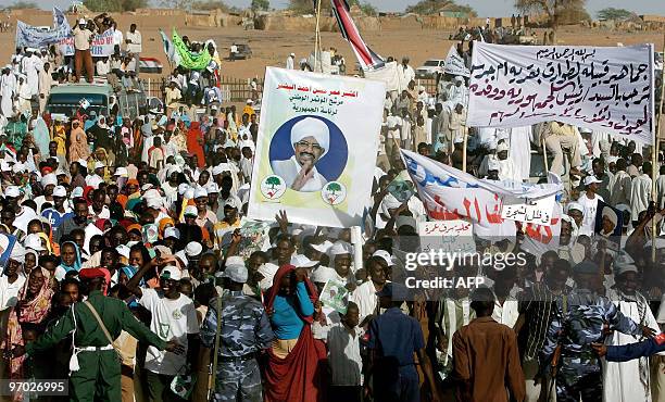 Sudanese gather at a rally attended by President Omar al-Beshir in El-Fasher, the capital of North Darfur state, on February 24, 2010. "The war in...