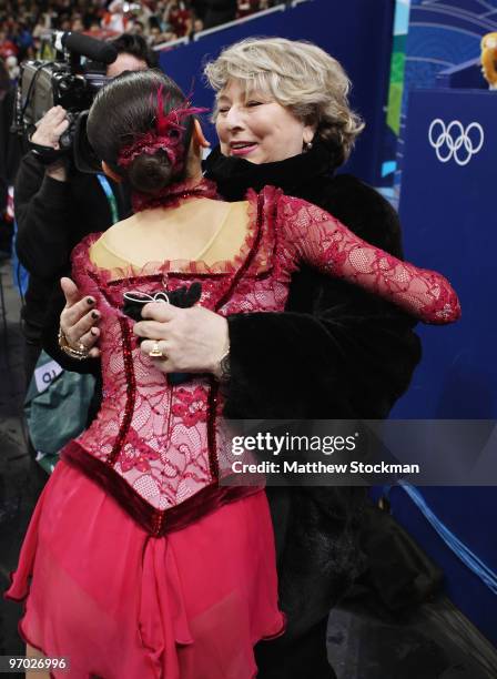 Mao Asada of Japan is greeted by one of her coaches Tatiana Tarasova after performing in the Ladies Short Program Figure Skating on day 12 of the...
