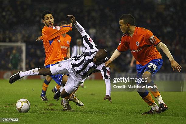 Youssouf Mulumbu of West Bromwich is tackled by Jobi McAnuff and Ryan Bertrand of Reading during the FA Cup sponsored by E.on 5th Round Replay match...
