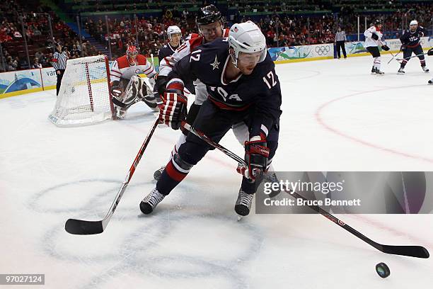 Ryan Malone of the United States controls the puck during the ice hockey men's quarter final game between USA and Switzerland on day 13 of the...