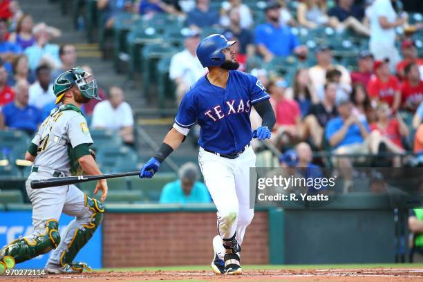 Nomar Mazara of the Texas Rangers hits in the first inning against the Oakland Athletics at Globe Life Park in Arlington on June 5, 2018 in...