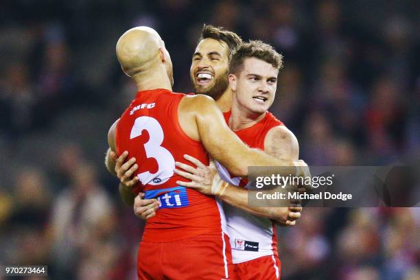 Tom Papley of the Swans celebrates a goal with Jarrad McVeigh and Josh Kennedy during the round 12 AFL match between the St Kilda Saints and the...