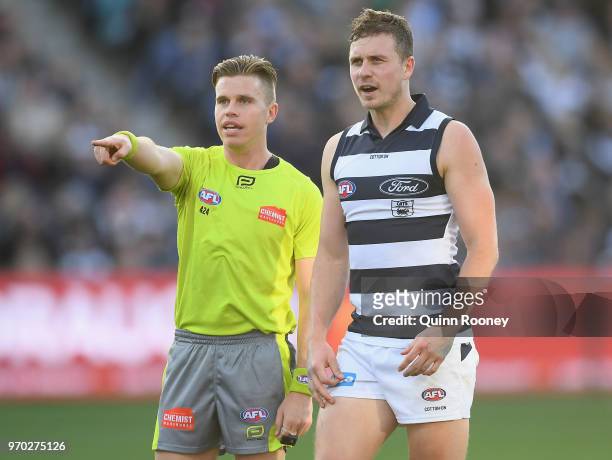 Mitch Duncan of the Cats talks to the umpire during the round 12 AFL match between the Geelong Cats and the North Melbourne Kangaroos at GMHBA...
