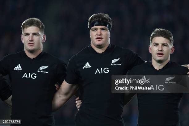 Jordie Barrett, Scott Barrett and Beauden Barrett sing the anthem during the International Test match between the New Zealand All Blacks and France...