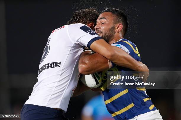 Bevan French of the Eels is tackled during the round 14 NRL match between the Parramatta Eels and the North Queensland Cowboys at TIO Stadium on June...