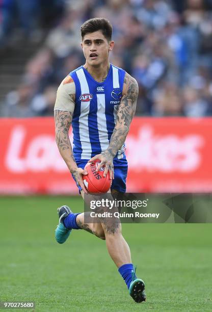 Marley Williams of the Kangaroos kicks during the round 12 AFL match between the Geelong Cats and the North Melbourne Kangaroos at GMHBA Stadium on...