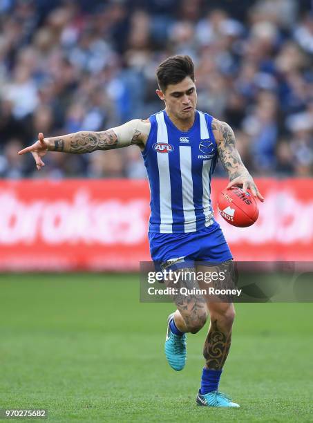 Marley Williams of the Kangaroos kicks during the round 12 AFL match between the Geelong Cats and the North Melbourne Kangaroos at GMHBA Stadium on...