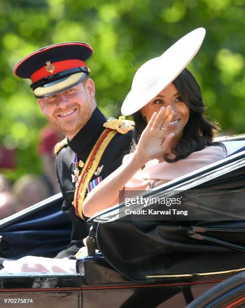 Prince Harry, Duke of Sussex and Meghan, Duchess of Sussex during Trooping The Colour 2018 at The Mall on June 9, 2018 in London, England. The annual...