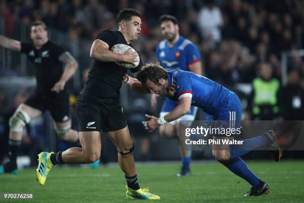 Anton Lienert-Brown of the New Zealand All Blacks is tackled by Maxime Mdard of France during the International Test match between the New Zealand...
