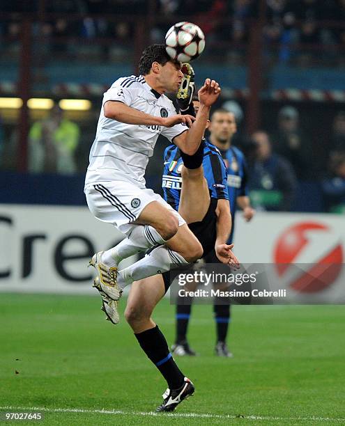 Lucio of FC Inter Milan battles for the ball against Michael Ballack of Chelsea during the UEFA Champions League round of 16 first leg match between...