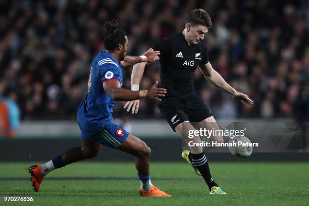 Beauden Barrett of the All Blacks kicks the ball through during the International Test match between the New Zealand All Blacks and France at Eden...