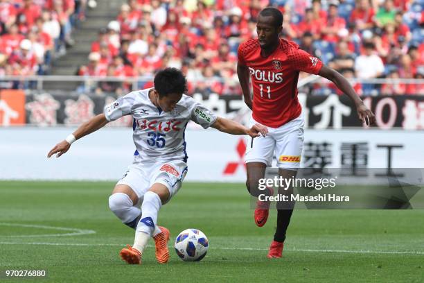 Ryo Takano of Ventforet Kofu and Martinus of Urawa Red Diamonds compete for the ball during the J.League Levain Cup Play-Off second leg between Urawa...