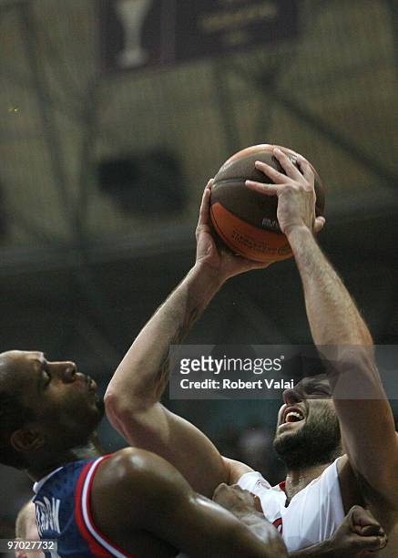 Jamont Gordon of Cibona competes with Ioannis Bourousis of Olympiacos Piraeus in action during the Euroleague Basketball 2009-2010 Last 16 Game 4...