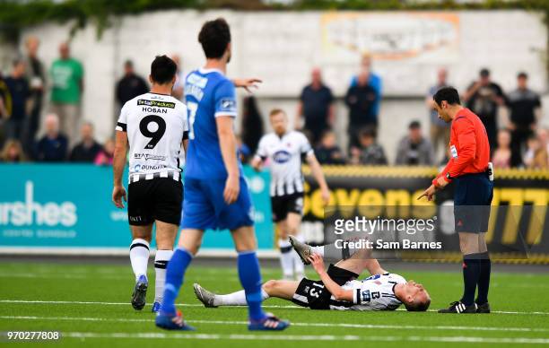 Dundalk , Ireland - 8 June 2018; Karolis Chvedujas of Dundalk lies injured during the SSE Airtricity League Premier Division match between Dundalk...