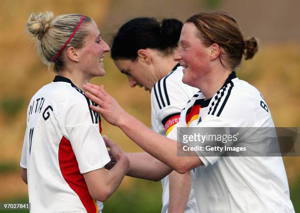 Anja Mittag and Melanie Behringer of Germany celebrate their team's first goal during the Woman's Algarve Cup match between Germany and Denmark at...