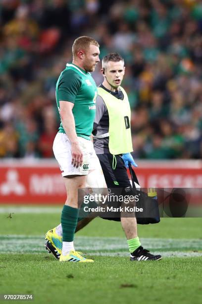 Keith Earls of Ireland leaves the field with a trainer during the International Test match between the Australian Wallabies and Ireland at Suncorp...