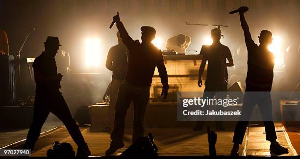 MCs Dokter Renz, Koenig Boris and Bjoern Beton of the German Hip-Hop band Fettes Brot perform live during a concert at the former east German...
